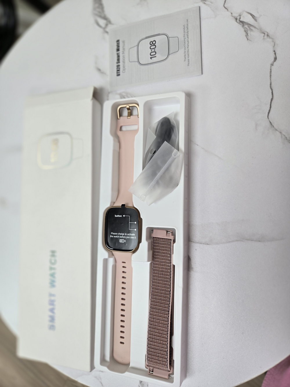Pink Smartwatch with Rose Gold Case and Extra Woven Band